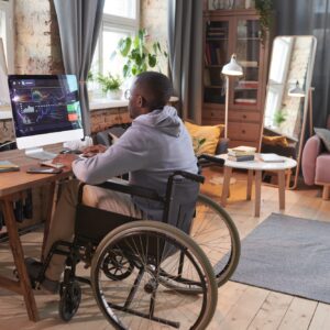 Programmer working on computer at home